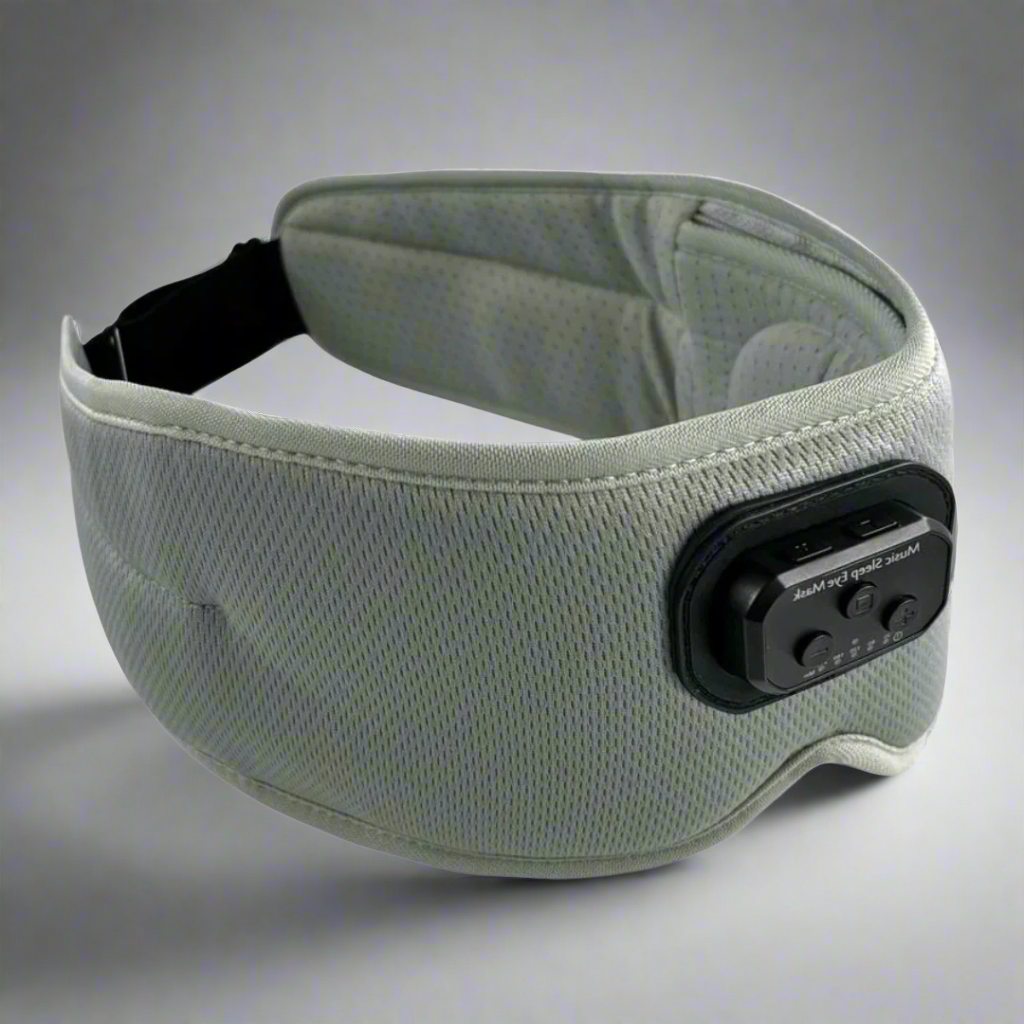 A blue Bluetooth sleep mask with integrated headphones and a control panel, designed to block light and provide white noise or music for relaxation.