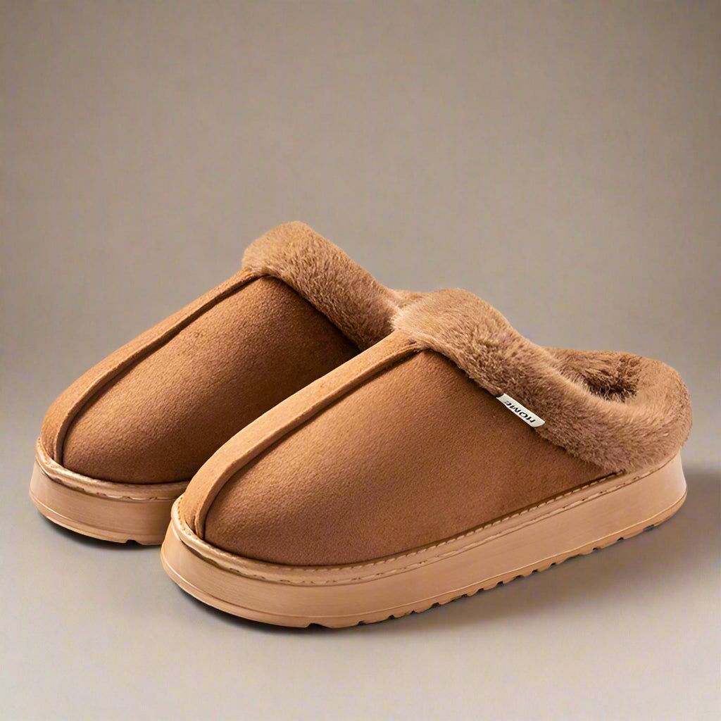 Brown winter slippers with fluffy lining on a beige background, labeled 'Winter slippers' and 'New in the fall of 2024'.