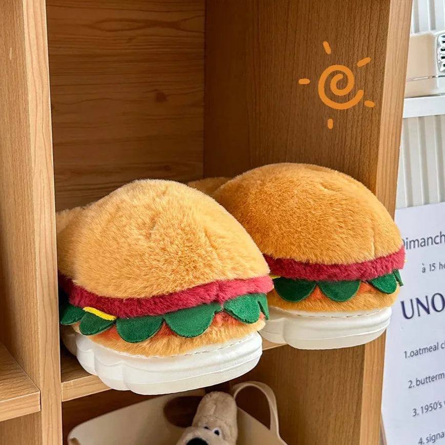 Hamburger-shaped slippers on a wooden shelf with a small dog toy in a basket below.