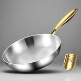 Stainless steel frying pan with gold handle on a dark background, featuring text about material and benefits.