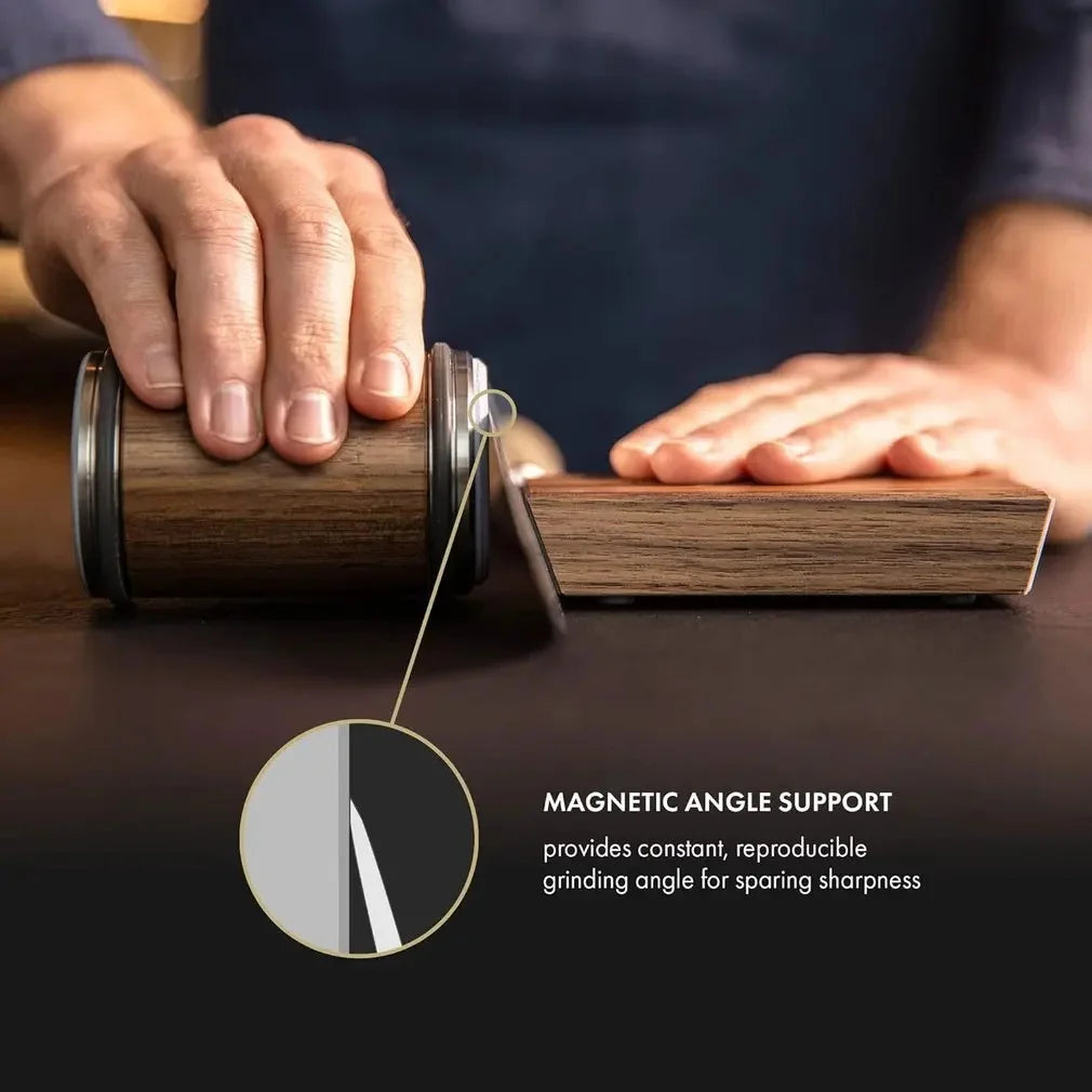 Person using a wooden tool with a magnetic angle support on a dark surface.