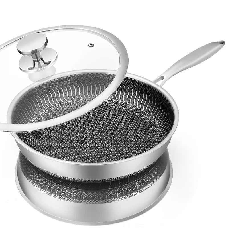 Stainless steel pot with lid on a white background