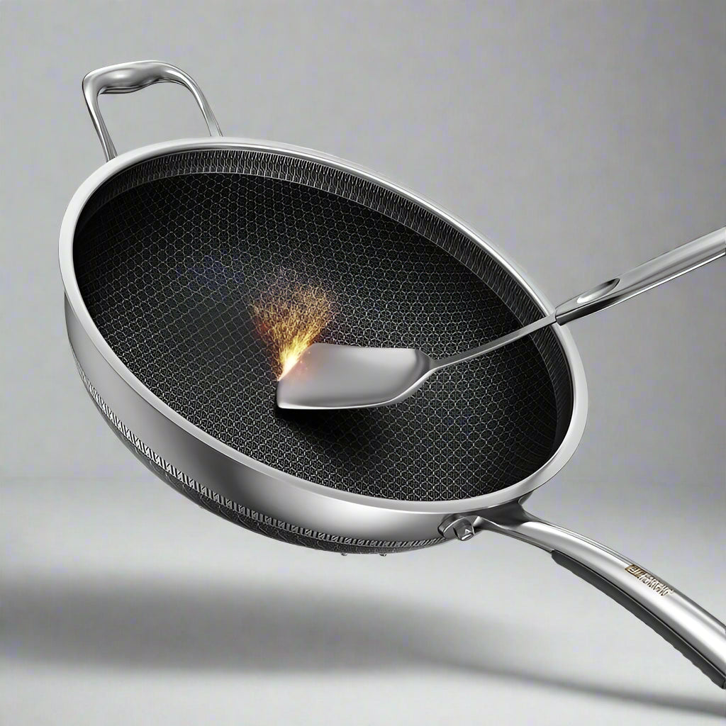 Stainless steel wok with a spatula on a light blue background