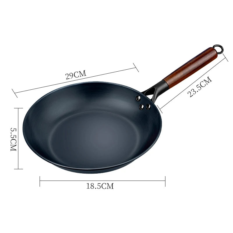 Black frying pan with wooden handle and dimensions labeled on a white background