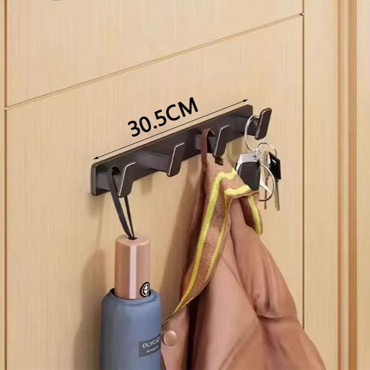 Wall-mounted hook with four hooks on a wooden door, displaying measurement '30.5CM'.