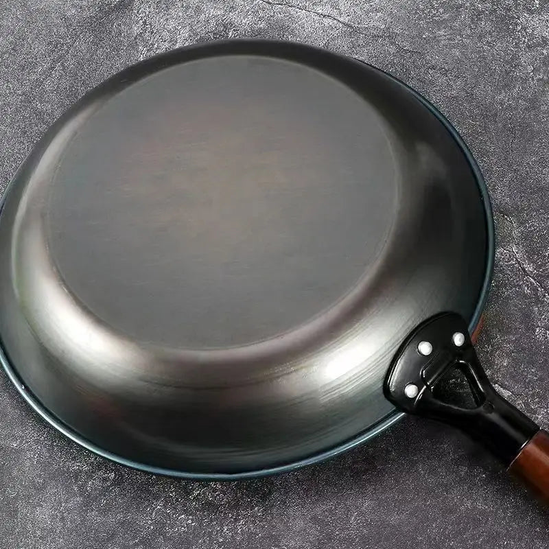 Black frying pan on a gray surface