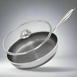Stainless steel frying pan with lid on a white background