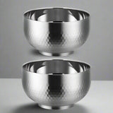 Two silver metallic bowls with a textured surface on a white background