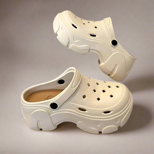A pair of beige women's platform garden clogs with a 7cm heel, featuring a slip-on design with front and rear straps, and ventilated hole construction.