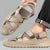 Beige sandals being worn on a blurred outdoor background