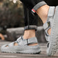 Gray sandals worn by a person on a wooden surface with a blurred background