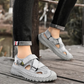 Gray sandals worn on a wooden surface with blurred background