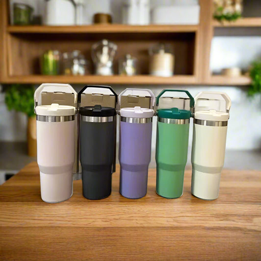 Set of five thermos cups in different colors with text indicating large capacity and durability.