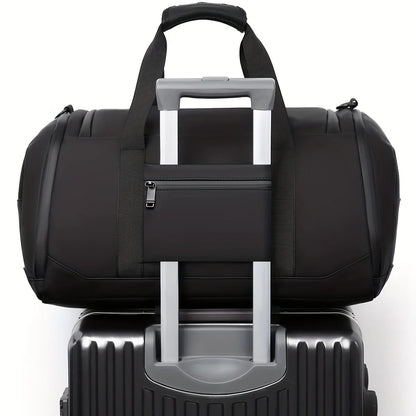 Black duffel bag with luggage trolley strap on a white background