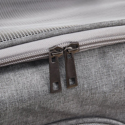 Close-up of a gray textured bag with a zipper and metal pull.