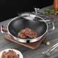 Stainless steel frying pan with honeycomb design containing seared meat on a wooden cutting board.