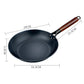 Black frying pan with wooden handle and dimensions labeled on a white background