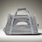Gray pet carrier with mesh front on a white background