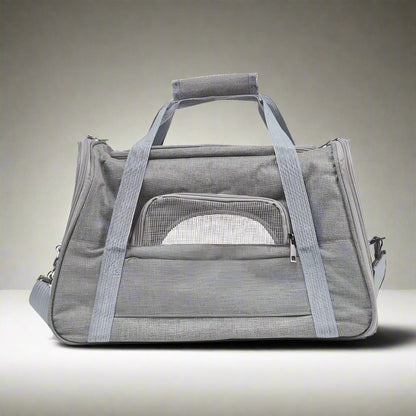 Gray pet carrier with mesh front on a white background