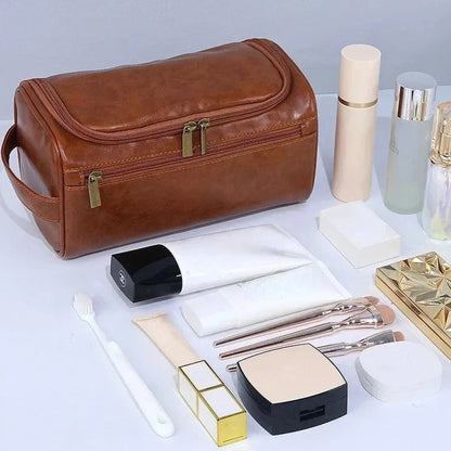 Brown wash bag with cosmetic items on a light gray background
