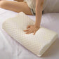Person holding a white pillow with text 'Slow rebound without collapse' on a light background