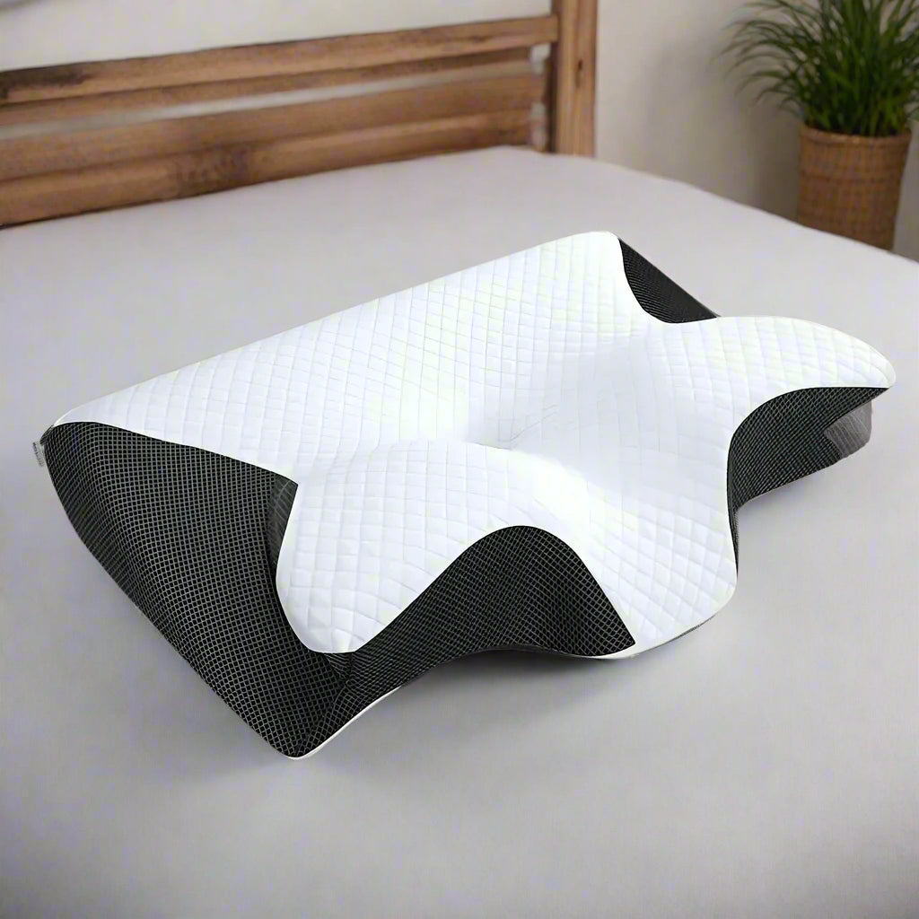 White and black ergonomic pillow cushion on a gray background
