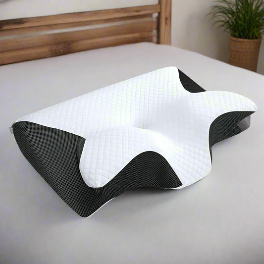 White and black ergonomic pillow cushion on a gray background